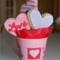 Mini Cookie Boquet This is my first attempt at decorated cookies. They are NFSC with MMF and RI decorations. They were small cookies that I put in a little 2....