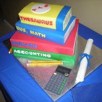 Graduation Book Cake Chocolate and vanilla cake with vanilla buttercream. All books covered in fondant. Diploma and calculator made of fondant. Pencils made...