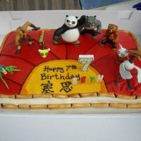 Kung Fu Panda Cake This is a Kung Fu Panda cake I just finished. I used fondant to make the bamboo border. I wasn;t that happy with it but the child loved it...