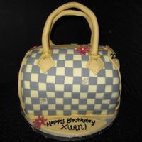 Louis Vuitton Purse Cake I enjoyed making this cake sooo much! It was fun but very time consuming to piece it one by one. My very first LV purse cake! TFL!!