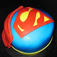 Superman Cake This cake was made for my friend's dad actually. Instead of it being labeled as "Superman," It was SuperDad! Such a cute...