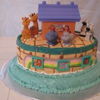 Noah's Ark Shower Cake I purchased the Little People's ark topper and animals online. The cake is baked in oval cake pans so I wouldn't have sculpt it....