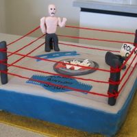 Wrestling Cake Got asked to make a wrestling cake for a 9 year old boy. Never attempted anything like it before, so was quite interesting to try.
