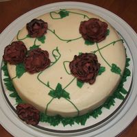 Wilton I - Last Class Cake The roses look kind of brown in the picture, but they are actually reddish in color. I was going to add more leaves around the bottom, but...