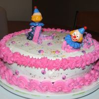 Wilton I - Second Class Cake I enjoyed decorating this cake because it was the first time I tried bag striping. I added a little bit of edible glitter and it really...