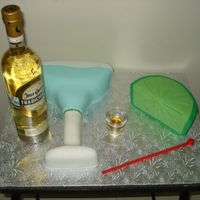 3-D Margarita Glass And Lemon 3-D Vanilla/Chocolate swirl cake, buttercream and fondant finish. The red stirrer was made in fondant.