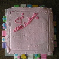 Taggie Cake I made this cake for the girl next door who is obsessed with her taggies blanket. The cake is iced in buttercream and the tags are made out...