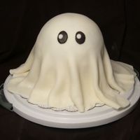 Casper This was a practice cake. First time making MMF/covering a cake. i think it turned out so cute!!! 2layer 6in round with 1/2 sports ball pan...