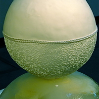 Spherical Cake Set Over Ice Oh boy how did I do this....with difficulty:!! I made the bottom half of the cake on a styrofoam semi circle. I then carved the top layer...