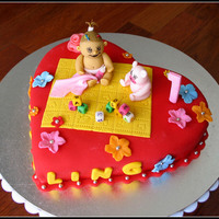 1St Birthday Cake Vanilla cake with chocolate filling, covered with buttercream and fondant.