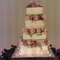Pink Heaven Iced in Buttercreme and silk flowers.