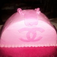 Pink Chanel Iced in Buttercreme with Fondant accents.