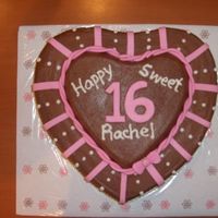 Pink And Brown Sweet 16 Chocolate cake with raspberry preserves. Chocolate buttercream accented with pink MMF and cream buttercream. Very fun to do!