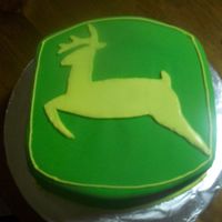 John Deere Cake Chocolate cake w chocolate ganache covered in fondant. I used RI for the deer.