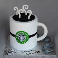 Starbucks For A New Police Officer bc base icing, fondant handle, steam and logo. Toy badge and cuffs. TFL
