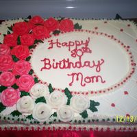 100_0239.jpg 11 x 15 x 2 marble cake. All butter cream with hershey kiss roses. 3rd cake ever decorated.