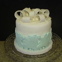 Ocean Wedding Cake This is a small centerpiece cake I made for a beach theme wedding.. I used a scroll mold for the fondant waves. The top is decorated with...