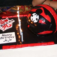 Bakugan Cake Gum Paste, Fondant, and Buttercream. Free hand painted Bakugan logo on gumpaste and free form cut fondant pieces assembled on bakugan ball...