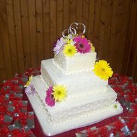 Daisy Wedding Cake This was my first real wedding cake. Needless to say, I was a nervous wreck. However, all turned out well. The red velvet cake was a hit...