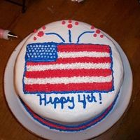 Our First Cake This is my husband's and my first attempt at decorating a cake. We used crusting buttercream and the Viva faux fondant method. The...