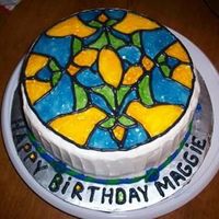 Stained Glass Birthday Cake White chocolate cake, white chocolate/bc filling, tined piping gel for stained glass look, fondant border.