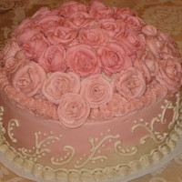 Pink Roses Birthday Cake Birthday cake for my sister. She loves buttercream, so I gave her a lot of it. It is 2-10 inch layers, and I put a 8 inch layer on top and...