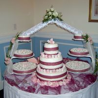 Wedding Cheesecake my daughter's wedding cake.....its a cheecake with rolled buttercream icing and fondant roses