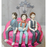 Jonas Brothers Cake A cake featuring gumpaste figurines of Jonas Brothers, made for a fan.