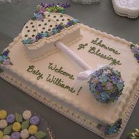 Umbrella Cake I did this for my SIL's baby shower I gave her this weekend. 12X18 half white, half chocolate. The umbrella was lemon. The flowers...