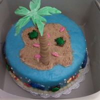 Sea Life Cake New photo with palm tree. I didn't think the palm tree was going to work but I ended up salvaging it! Palm tree is made of gum paste...