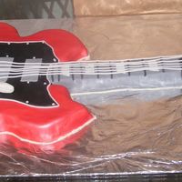 A Gibson Guitar This cake I did from a photo the groom gave me of his guitar. It's my first really detailed cake- and i enjoyed making it so much! It...