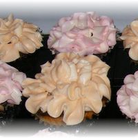 Flower Cupcakes My first attempt EVER to make cupcakes w/ buttercream flowers on top. Don't know the kind of flower, but I watched a tutorial on...