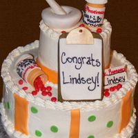 A Pharmacy Grad. Cake This cake was done for a pharmacy grad. all the decorations done in gumpaste.