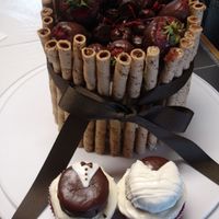 Anniversary Cake An Anniversary cake I made for my SIL and BIL. Red Velvet cake with chocolate dipped fruit and Pirrouette cookies surrounding cake....