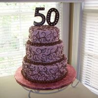 Rhonda50_Small.jpg Butter cream frosting. I made the 50 out of chocolate candy melts and a candy mold.