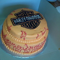 Harley Davidson Ok, not the best flames, but otherwise I was happy! Color flow logo. This was my first paying cake job!