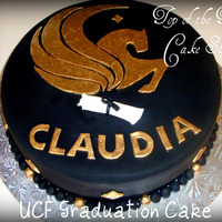 Ucf Graduation Cake 12 inch vanilla cake with dulce de leche filling covered in black fondant. I made a template for the pegasus and cut it out with fondant....