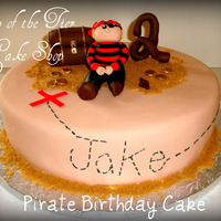 Pirate Birthday Cake 12 inch vanilla cake w/ dulce de leche filling covered in fondant. Pirate, treasure chest, coins and number 2 are all made of fondant/...