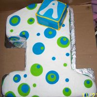 Number 1 With Polka Dots Made for a baby First birthday BC icing with the polka dots in MMF... Made the box so that the Birthday boy could have that as his own cake...