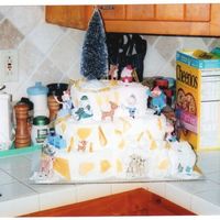 Rudolph Christmas Cake This was a 3 tier paisley shaped cake for the Christmas Family Reunion. It is iced in buttercream to look like a snow mountain with ice...