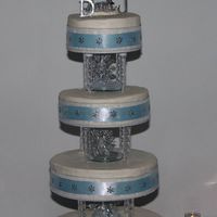 122980200950143.jpg I made this snowflake-themed cake for my daughter's 12/6/08 wedding. The snowflakes between layers are actually lighted from behind. I...