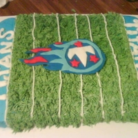 Titans Titans Football cake.... Football field is done in bc icing and the symbol is fondant. Hope you like