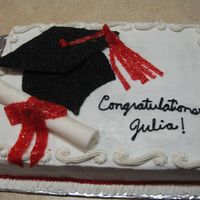Graduation Cake Graduation cap done with candy melts and black sugars, scroll is fondant with with fruit roll up and red sparkles ribbon