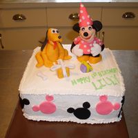 Minnie And Pluto B Cake fondant minnie and pluto on top of frosted cake with fondant ears