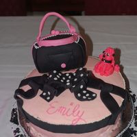 Poodle Cake pink poodle cake made with black fondant purse and bow.