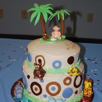 Jungle Animal Cake baby shower cake made with fondant animals and baby