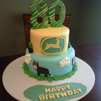 John Deere Cake Made from Fondant except the "80" and the tractors which were done in chocolate molds. I used my Cricut Cake to do the cows and...