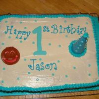 First Birthday Well I wasn't to thrilled with this cake...It was my first sheet cake...First time decorating on cream cheese frosting and my first...