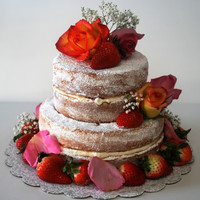 Orange Cake orange zest cake with Grand Marnier buttercream and raspberry jam filling. Topped with fresh fruit and berries.