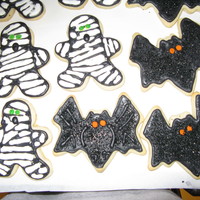 Mummies And Bats This was the first time I've ever made iced cookies... the mummies were a pretty poor attempt... quite labor intensive for a newby......